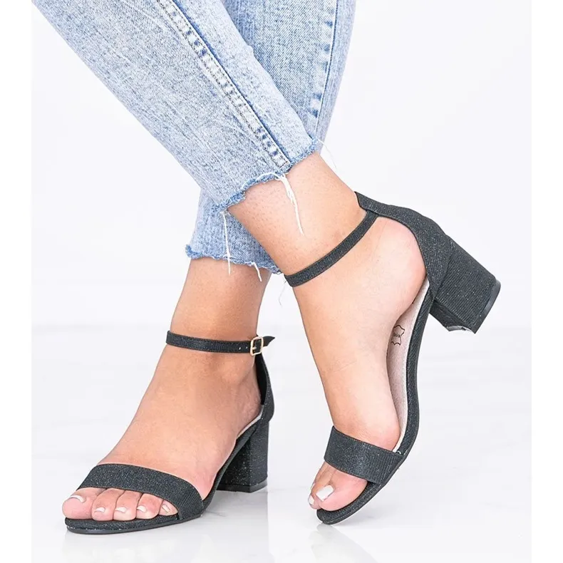 Black shiny sandals on a low post from Malabo